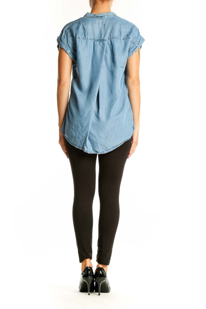 Side view of light blue Tencel button-up short sleeve top on model