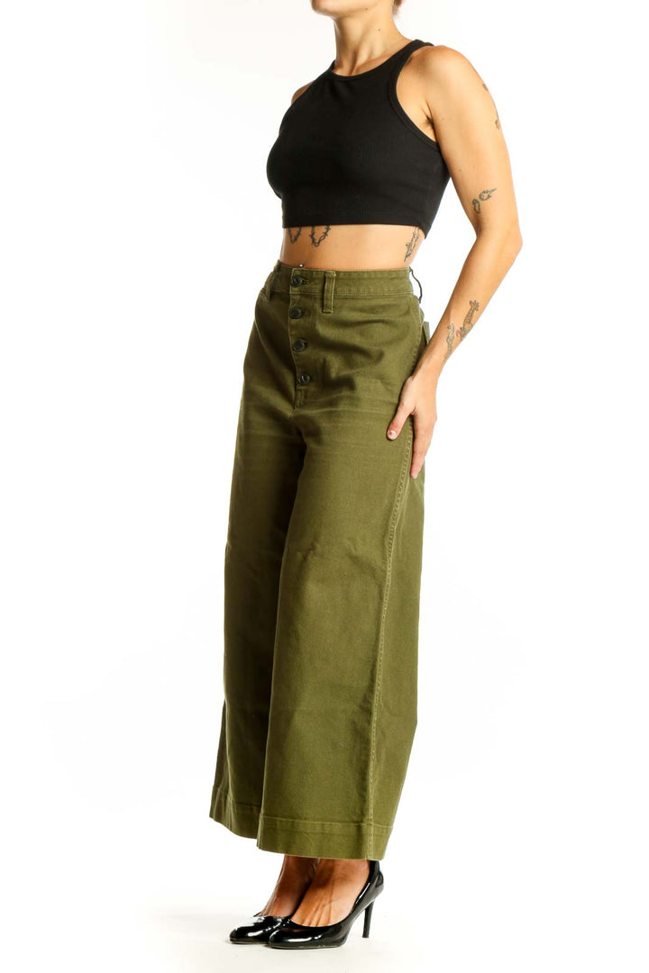 Front view of olive Madewell wide-leg pants with button-front closure