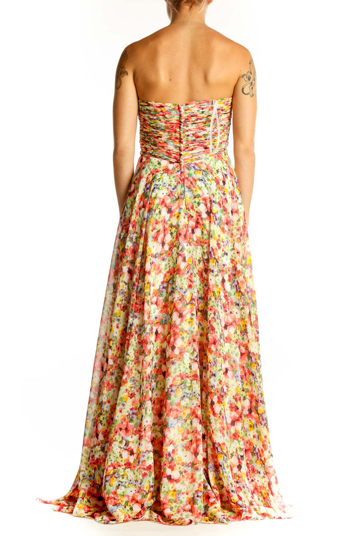 Side view of multicolor floral strapless gown showing full-length silhouette