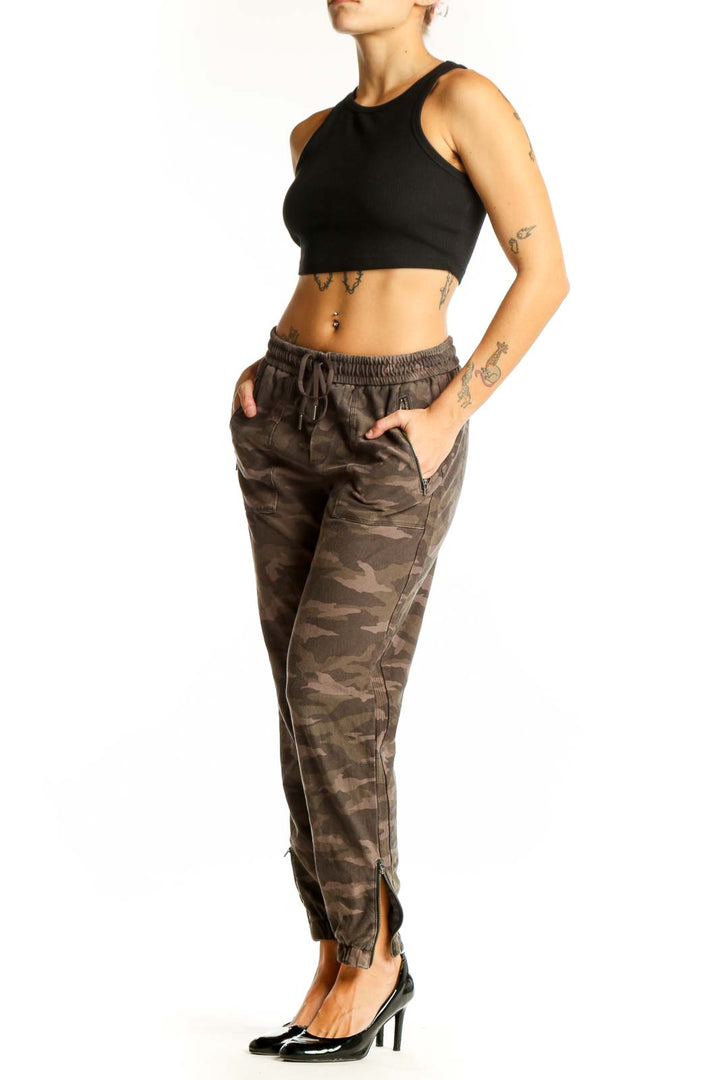 Front view of Athleta brown camo jogger pants with elastic waistband and side pockets