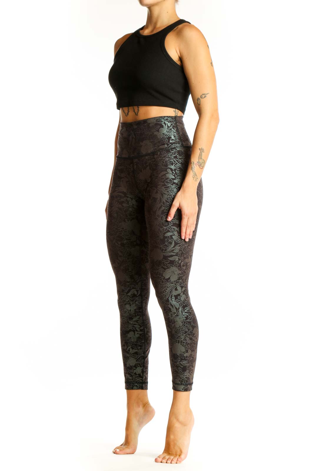 Front view of Lululemon dark green floral print high-waisted activewear leggings