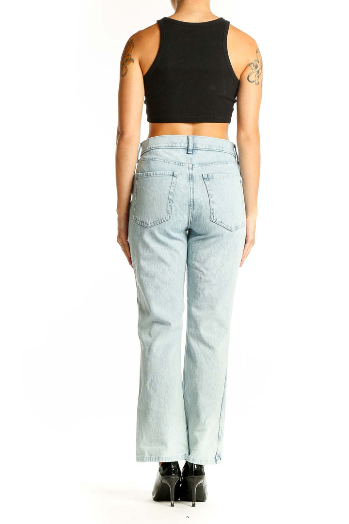 Side view of Banana Republic light blue straight leg jeans on model