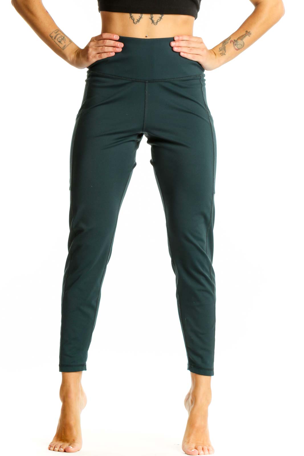 Front view of dark green high-waisted activewear leggings from Banana Republic