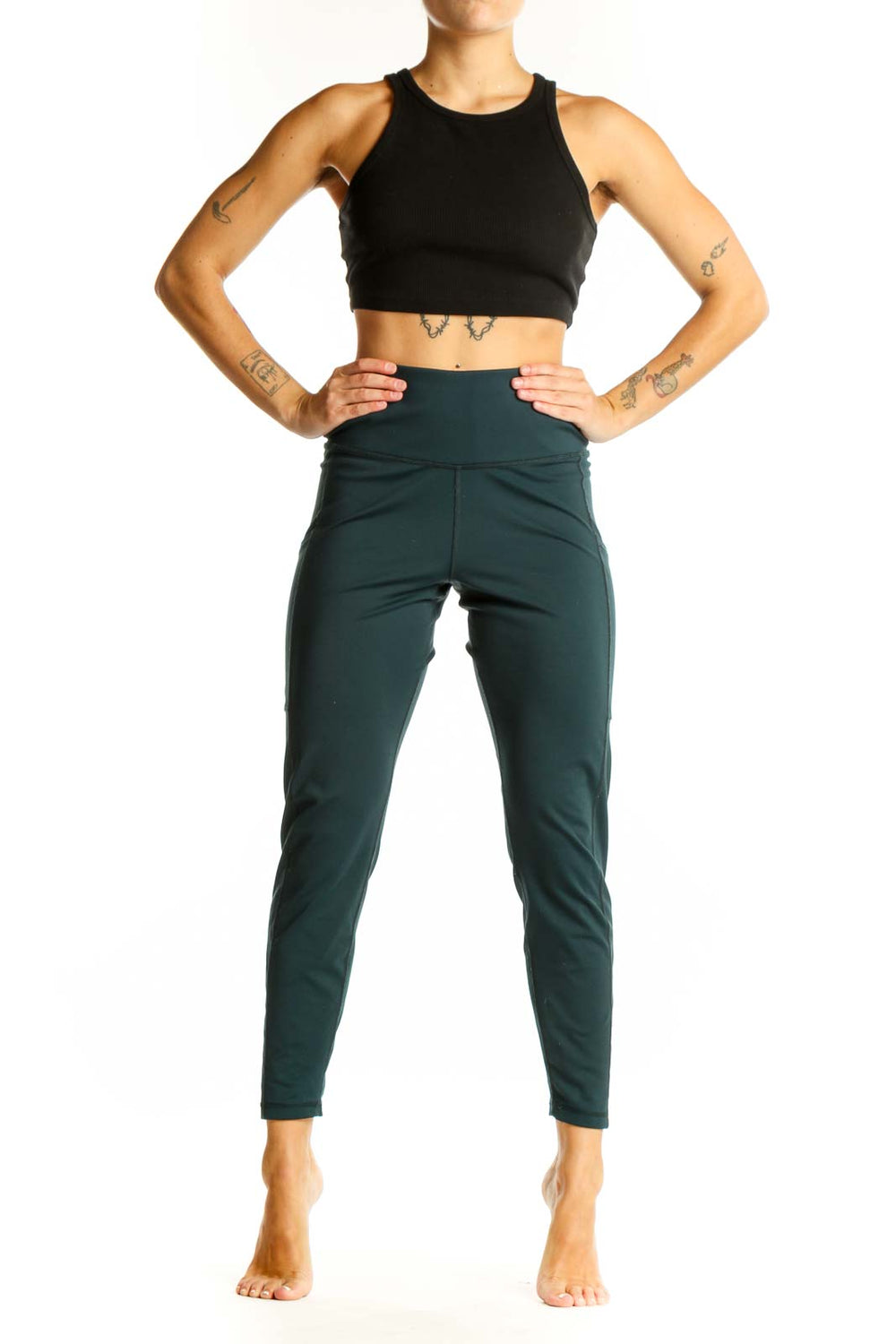 Front view of dark green high-waisted activewear leggings from Banana Republic