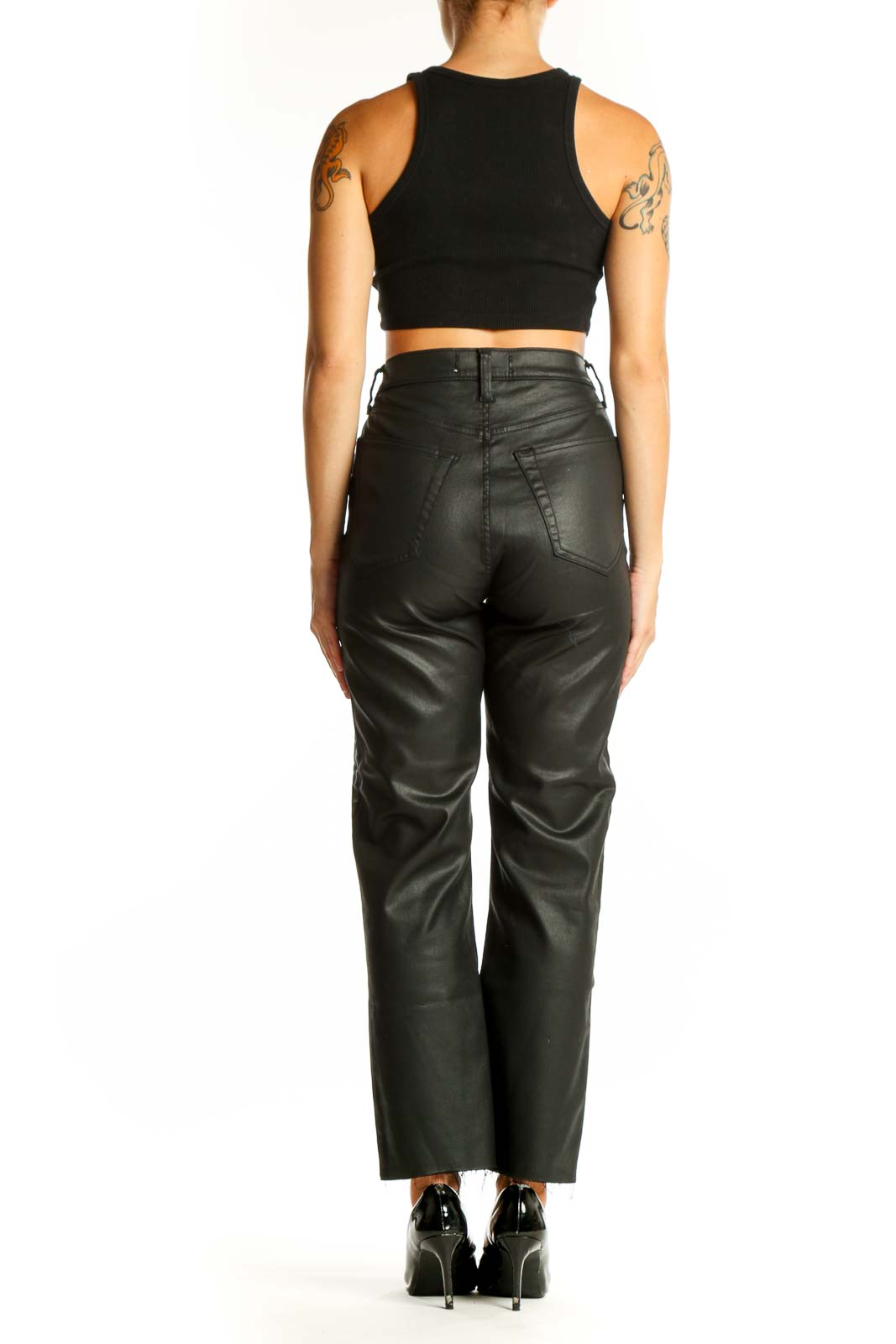 Side view of model wearing Abercrombie & Fitch black faux leather pants with crop top