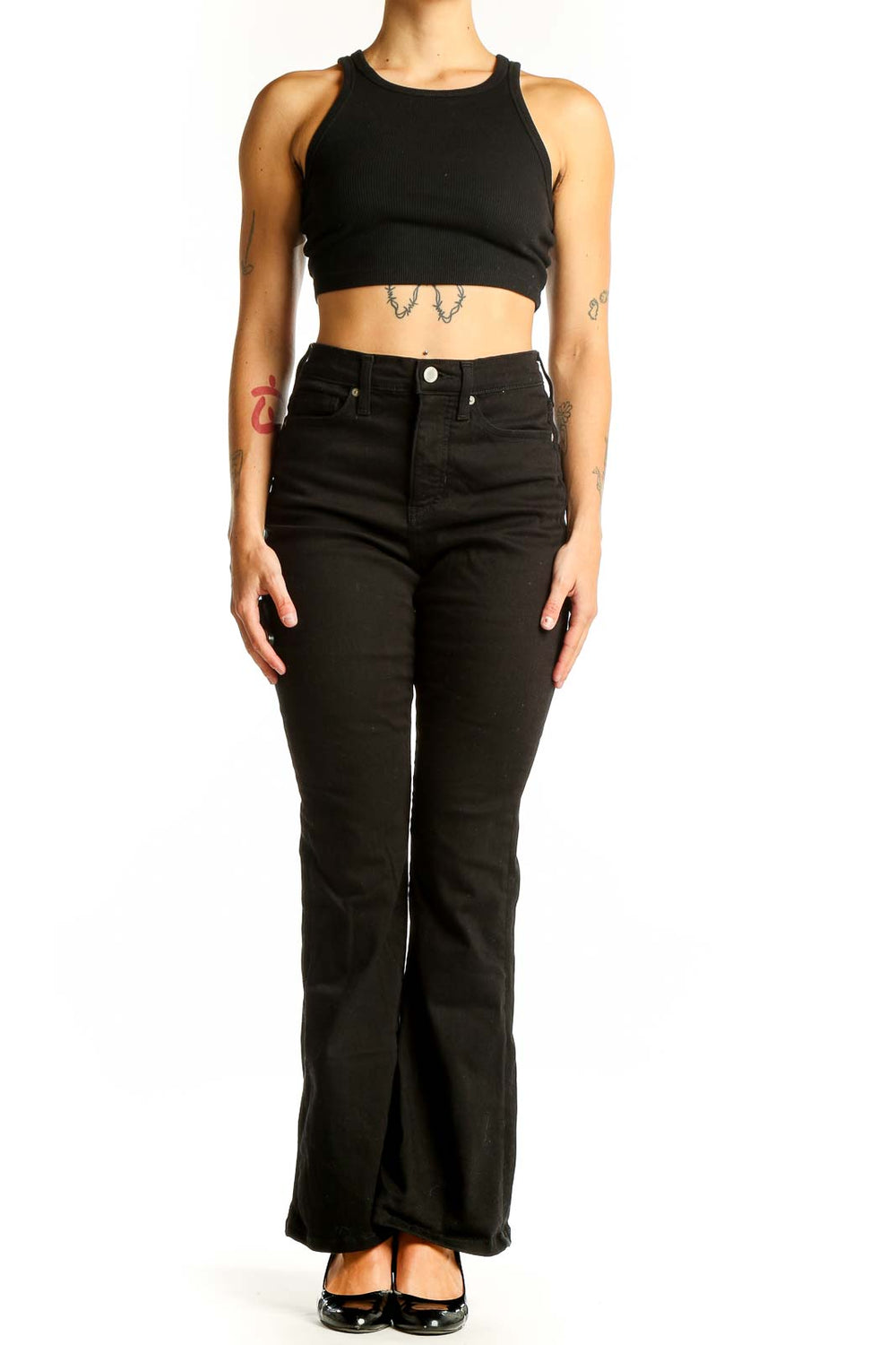 Front view of Banana Republic black high-waisted flared jeans on model