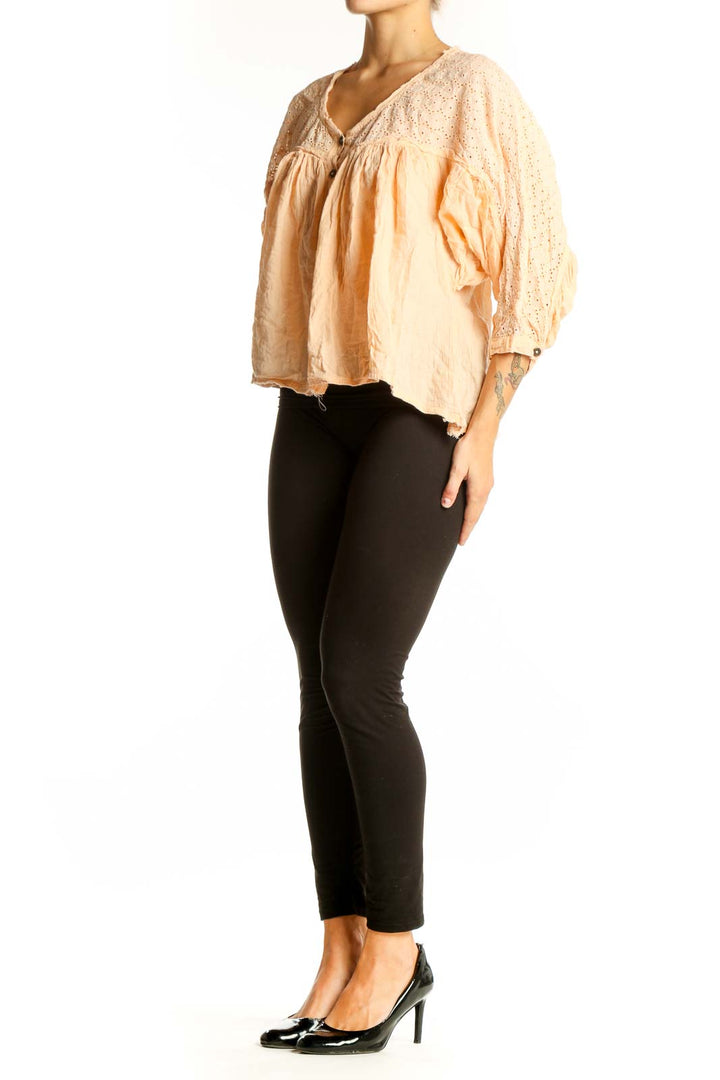 Front view of Free People peach eyelet lace button-up blouse