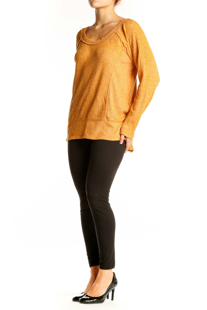 Front view of orange textured knit sweater by Eri + Ali