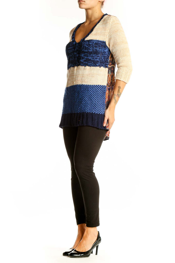 Front view of Nick & Mo blue and beige striped V-neck knit sweater with color-block design