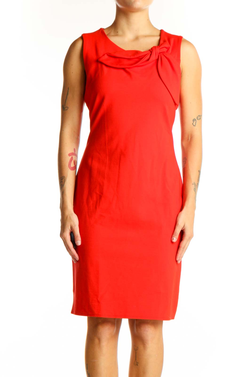 Front view of red sleeveless Banana Republic sheath dress with bow detail