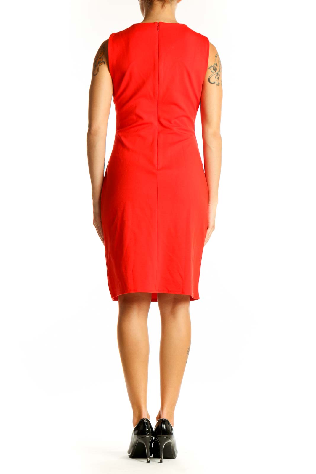 Side view of red sleeveless Banana Republic sheath dress showing fitted silhouette