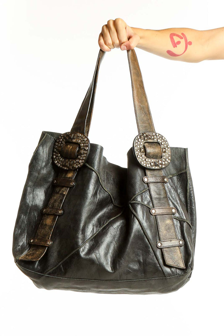 Front view of SilkRoll black leather tote bag with embellished buckles
