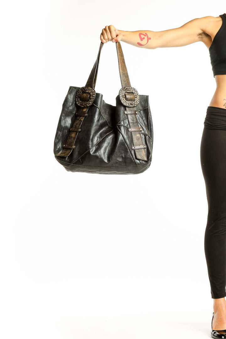 Front view of SilkRoll black leather tote bag with embellished buckles