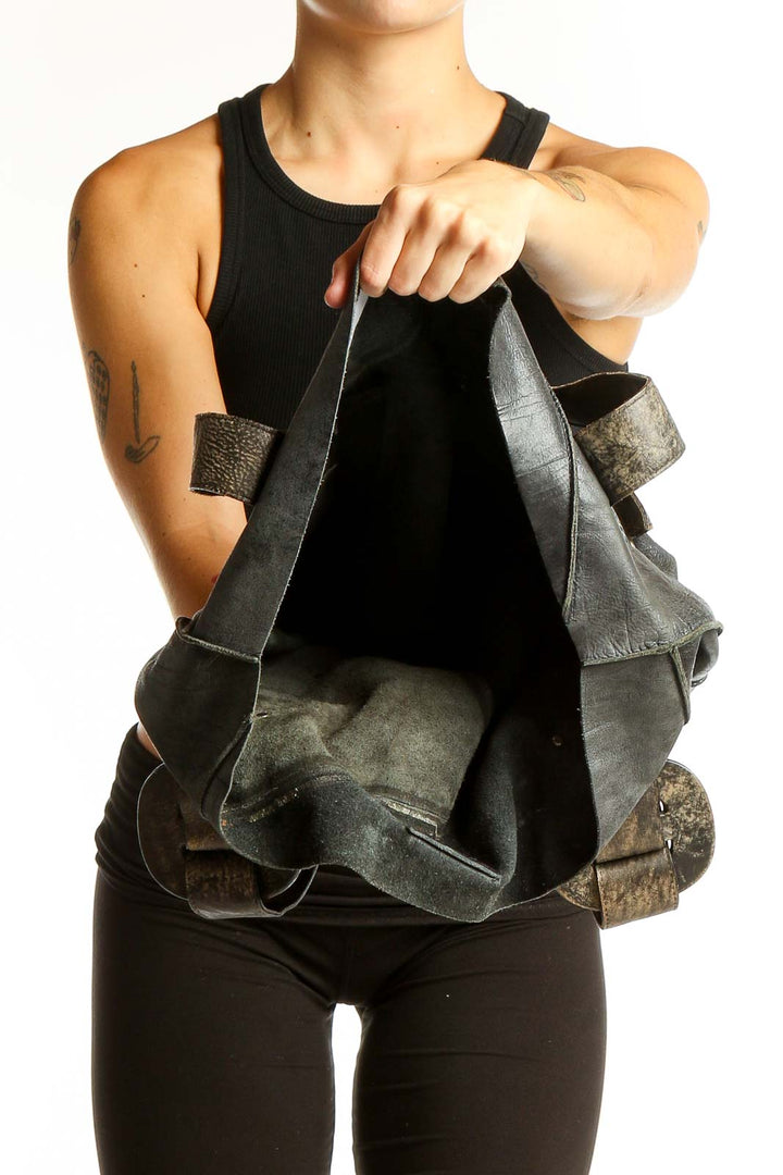 Side view of SilkRoll black leather tote bag worn on shoulder