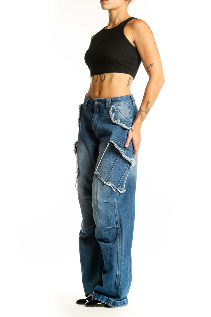 Front view of Love + Harmony blue distressed wide-leg cargo jeans with oversized pockets