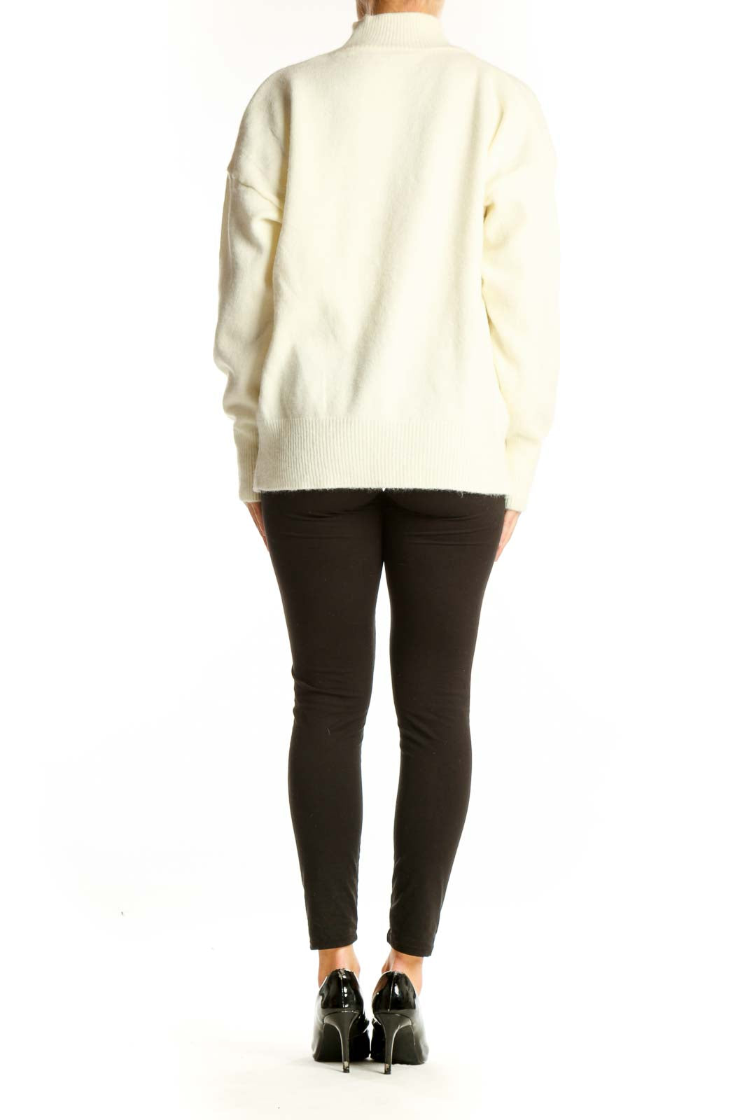 Side view of cream SilkRoll mock neck sweater showing relaxed fit