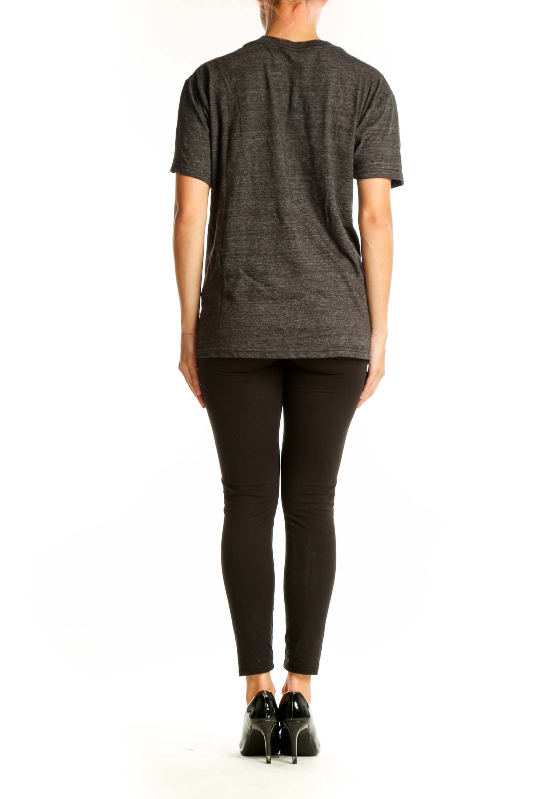 Side view of person wearing gray Guns N' Roses t-shirt with black pants