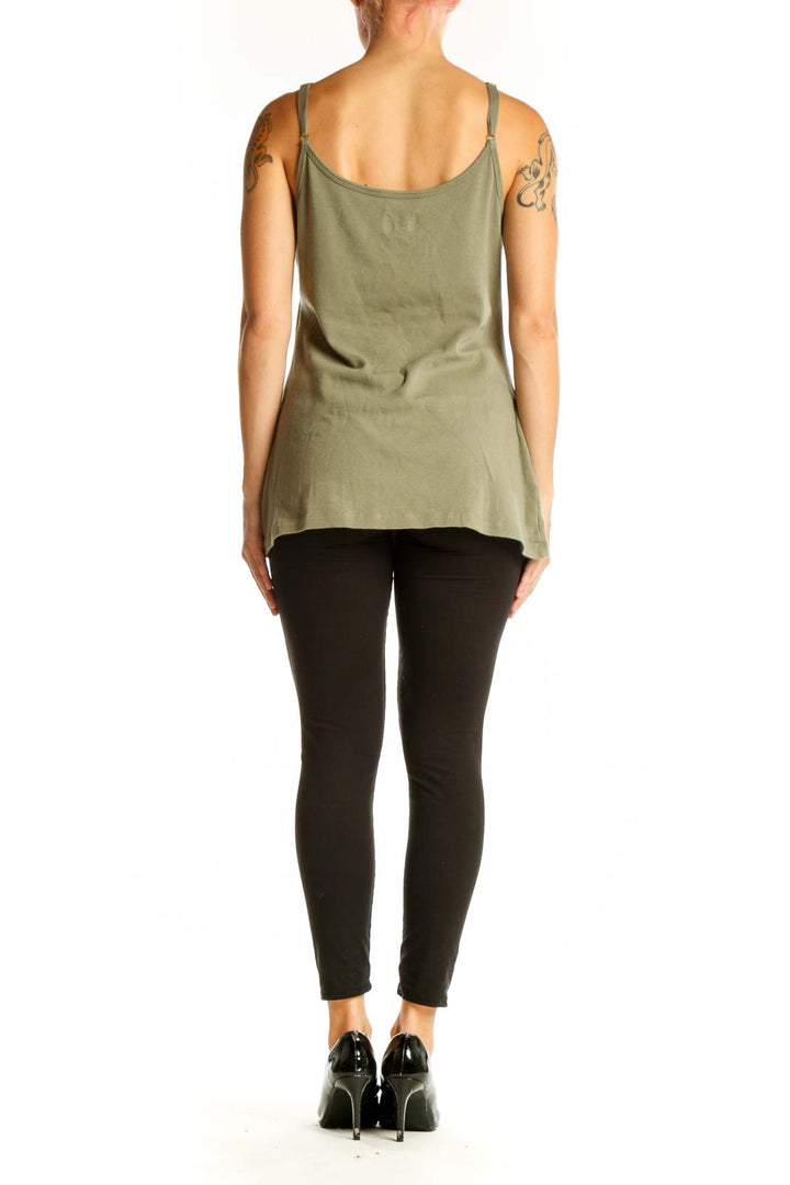 Side view of olive green Ruff Hewn tank top on model with black pants