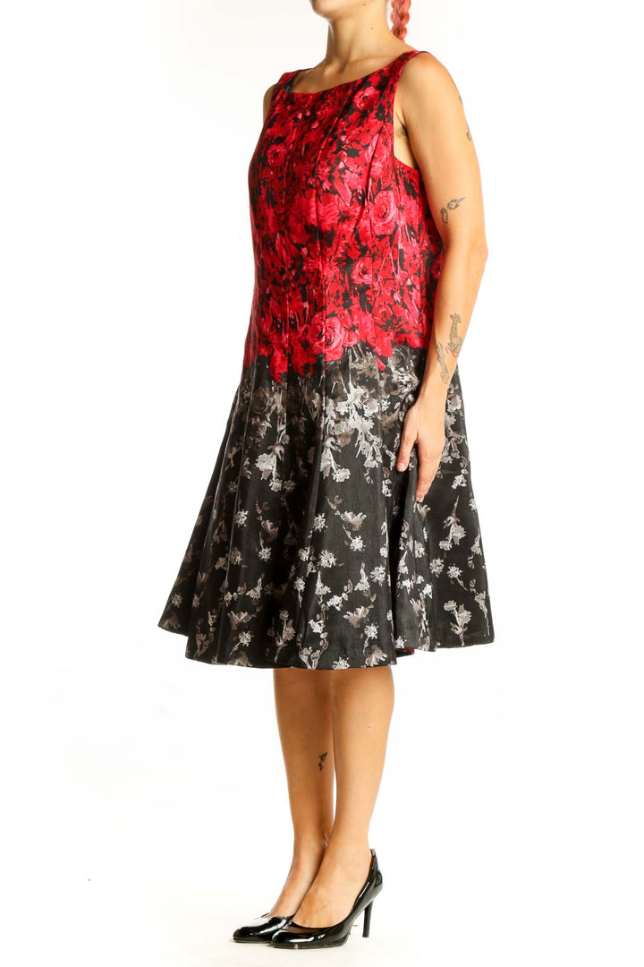 Front view of red and black floral sleeveless dress by Julian Taylor
