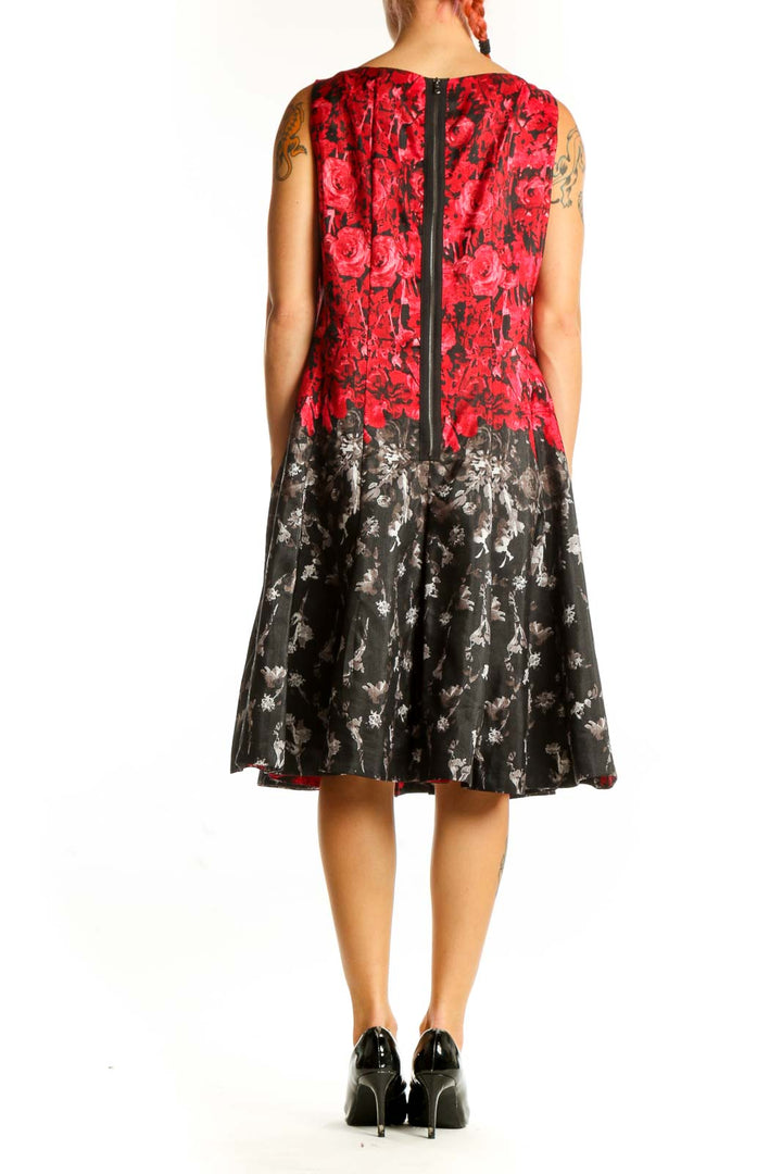 Side view of red and black floral sleeveless dress by Julian Taylor