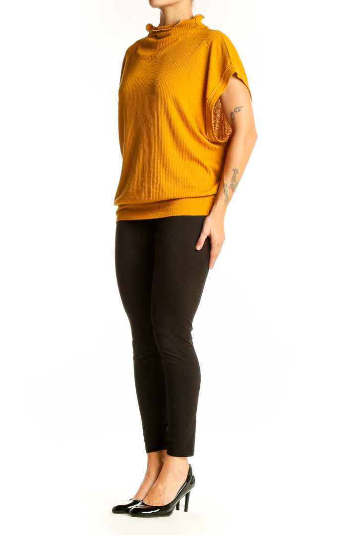 Front view of WE THE FREE mustard ribbed mock neck top