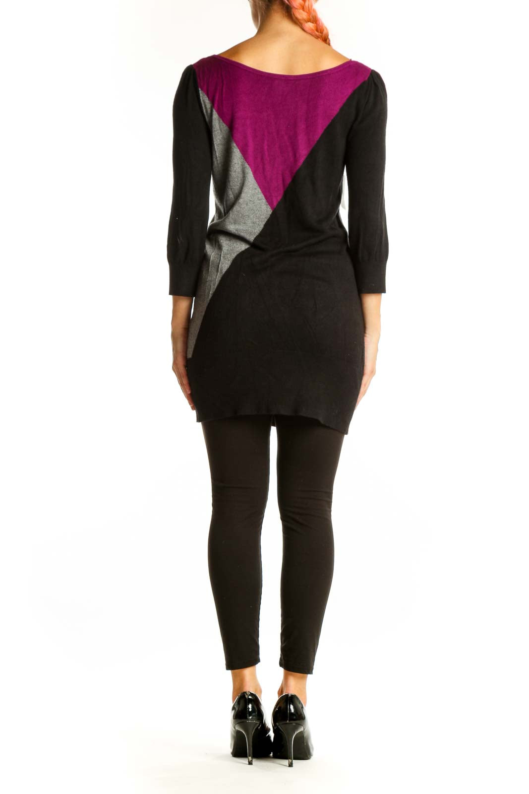 Side view of White House Black Market color block knit tunic showing geometric design