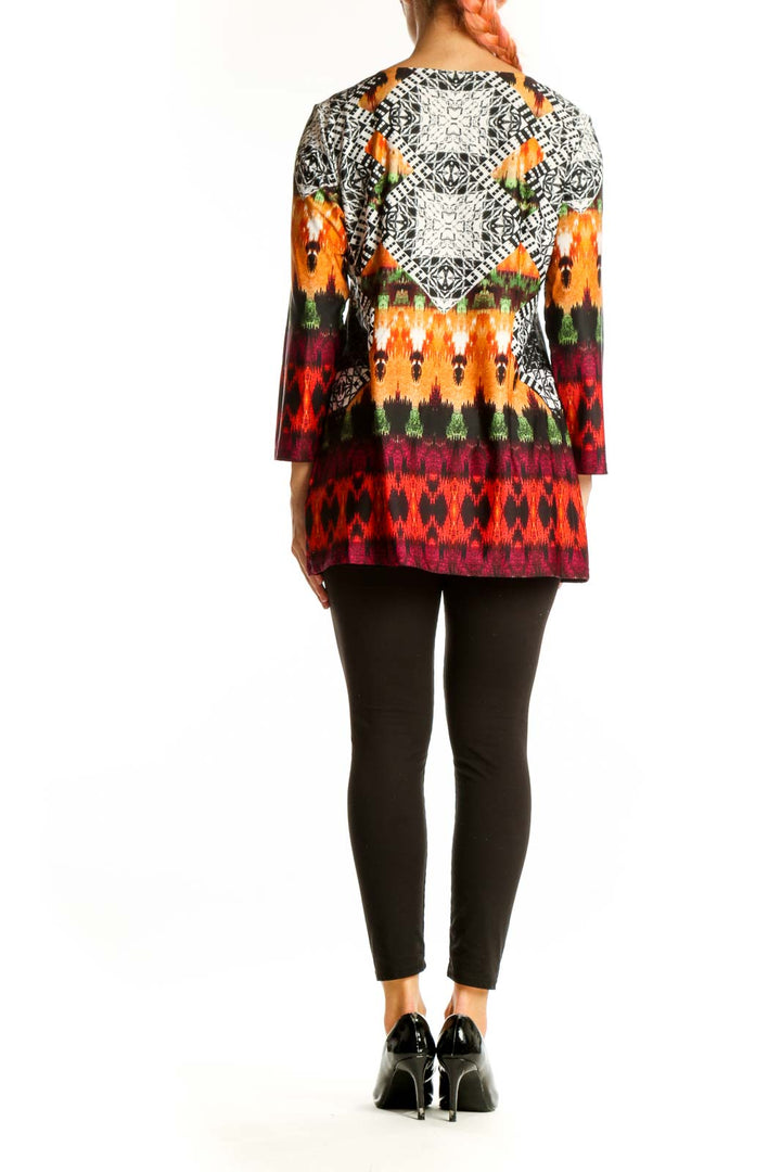 Side view of Melissa Paige multicolor geometric print tunic top showing 3/4 length sleeves