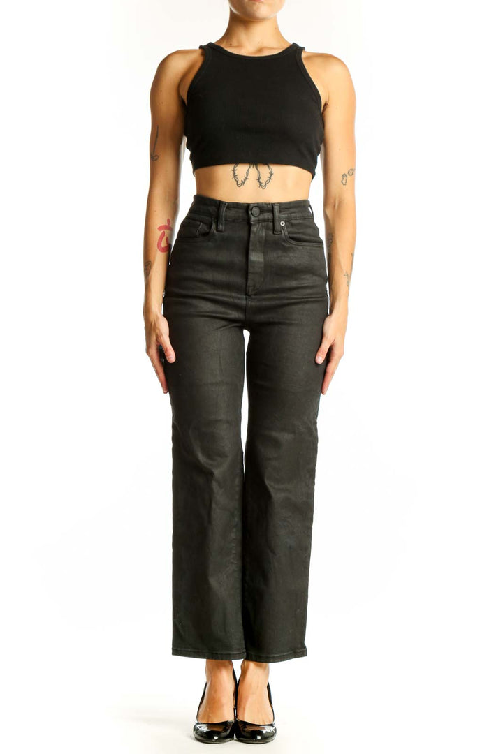 Front view of BLANKNYC black high-waisted wide-leg jeans on model