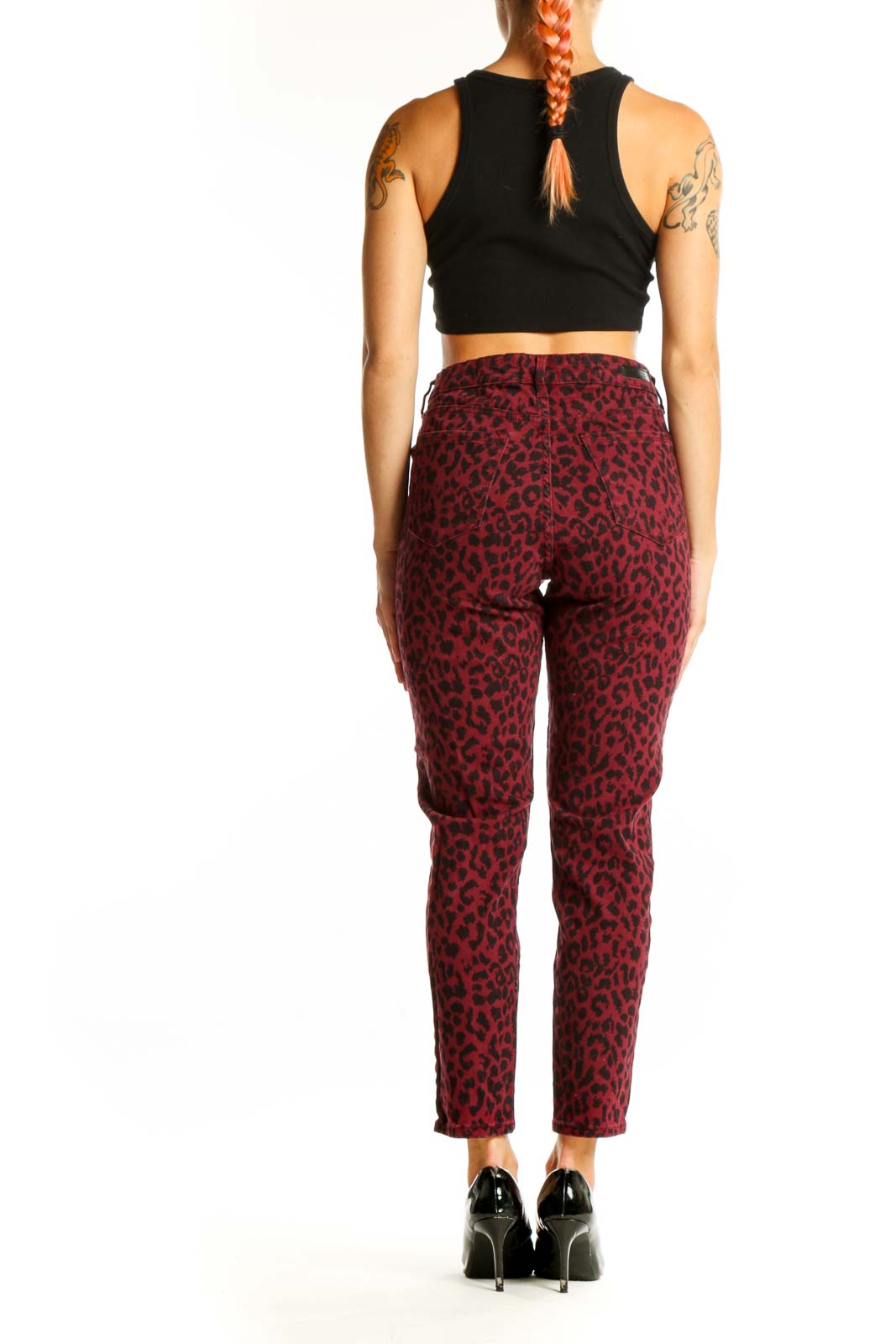 Side view of model wearing burgundy leopard print cotton pants with black top
