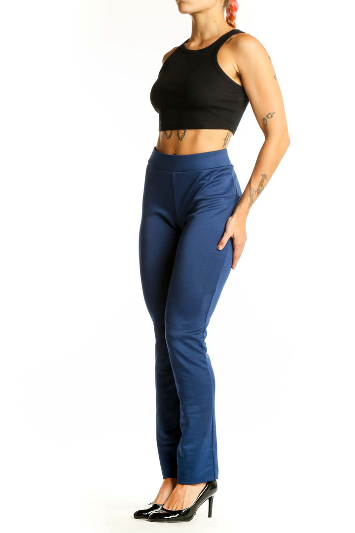 Front view of ECI navy straight-leg pants on model