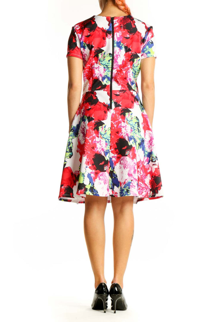 Back view of Milly multicolor floral print fit-and-flare dress with twirling motion