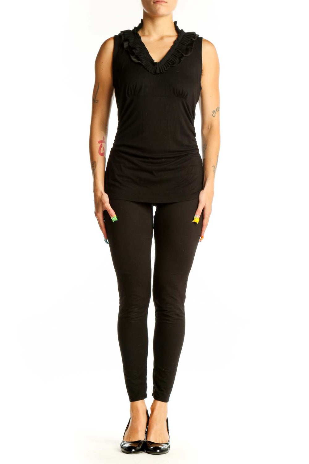 Front view of black ruffle-neck sleeveless top from White House Black Market