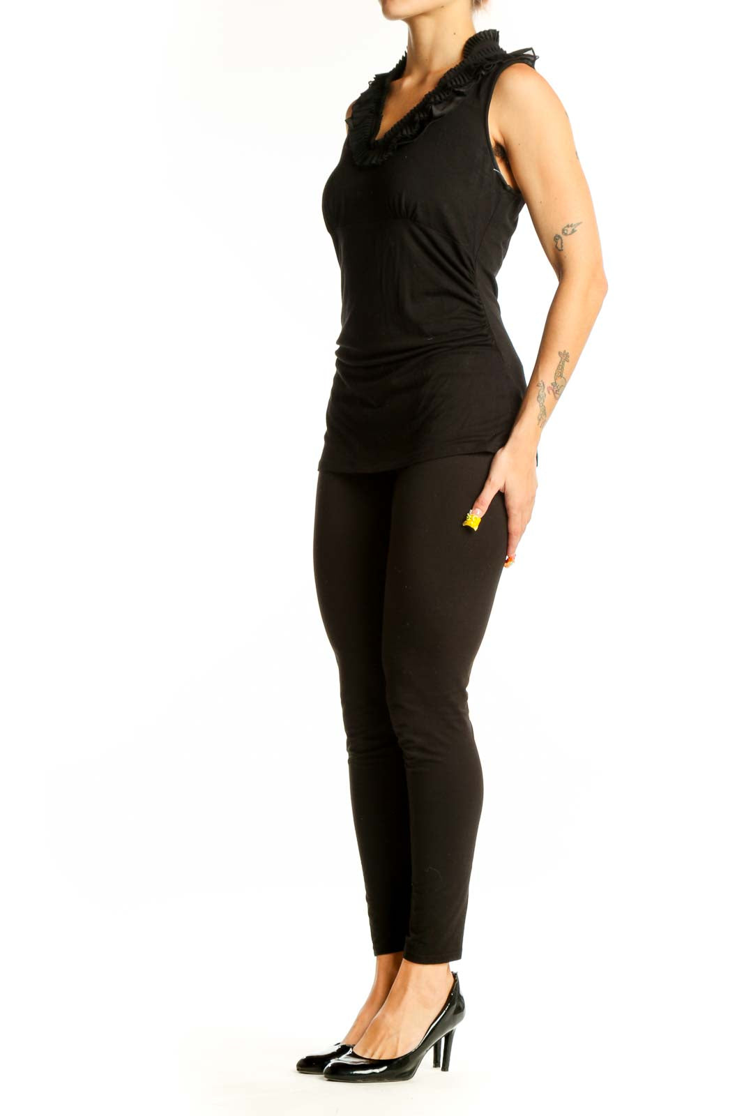 Front view of black ruffle-neck sleeveless top from White House Black Market