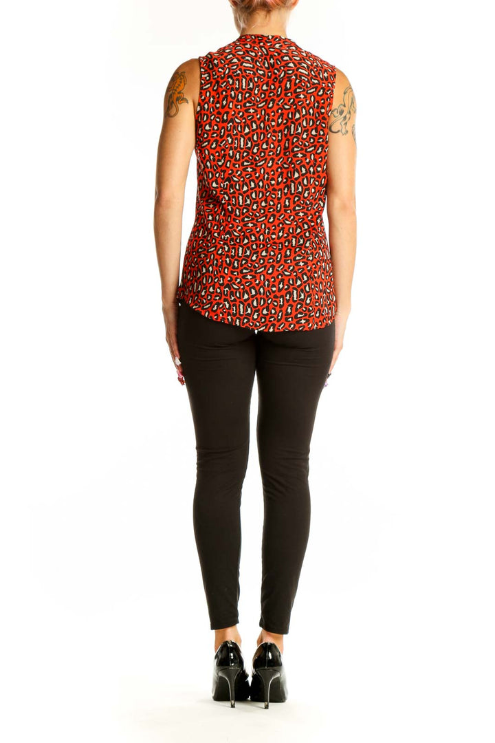 Side view of red leopard print sleeveless blouse on model