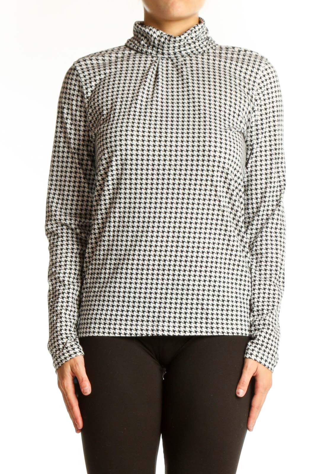 Front view of J.Crew black and white houndstooth turtleneck top
