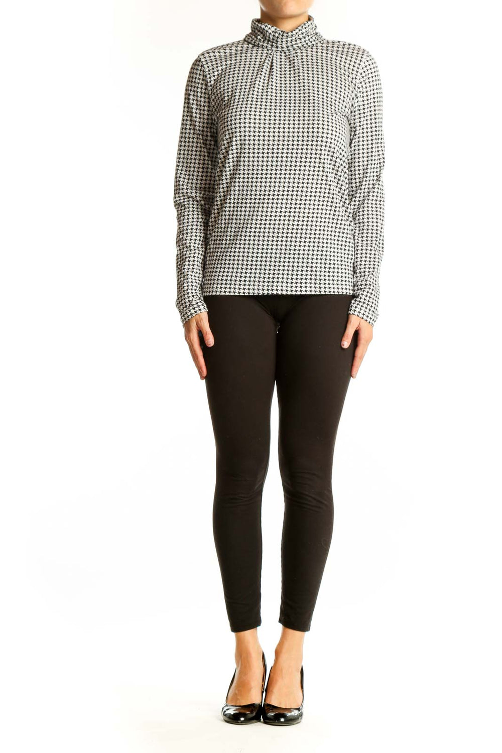 Front view of J.Crew black and white houndstooth turtleneck top