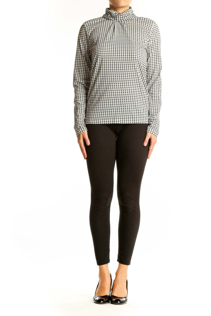 Front view of J.Crew black and white houndstooth turtleneck top