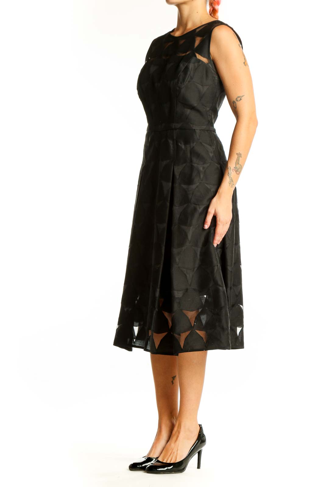 Front view of black Milly midi dress with geometric cut-out pattern