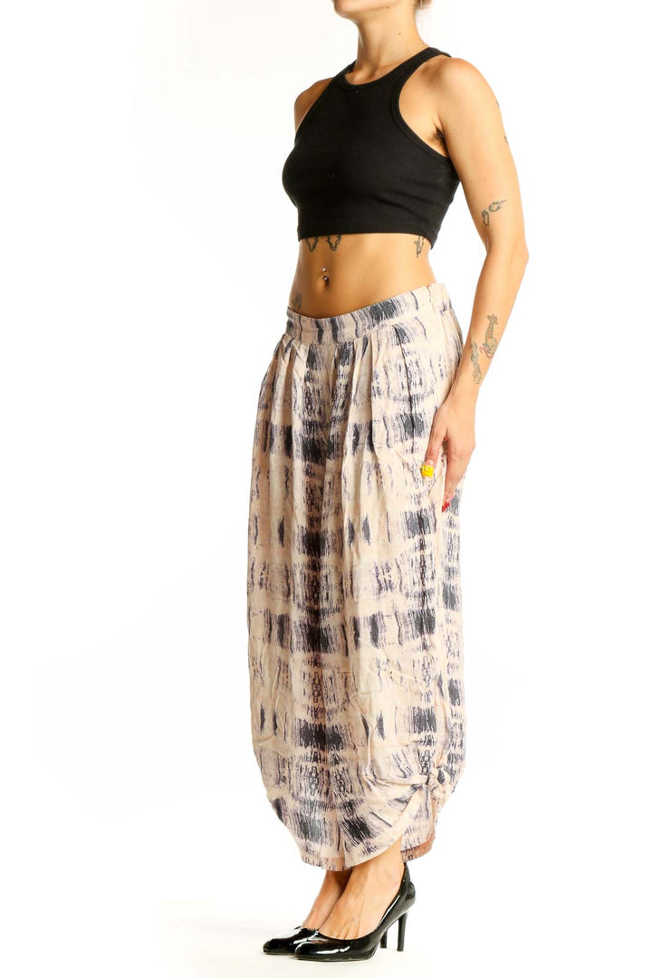 Front view of Elevenses beige tie-dye wide-leg cotton pants