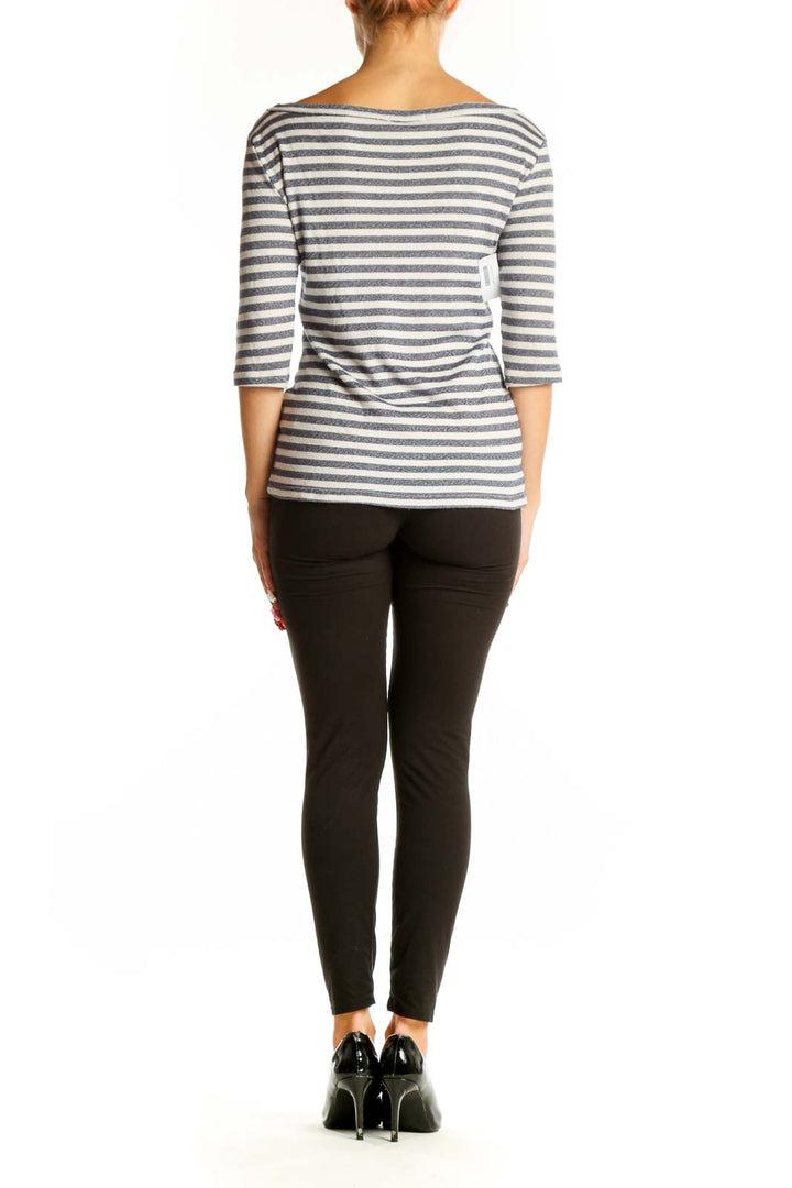 Back view of Michael Stars gray and white striped top on model with black pants