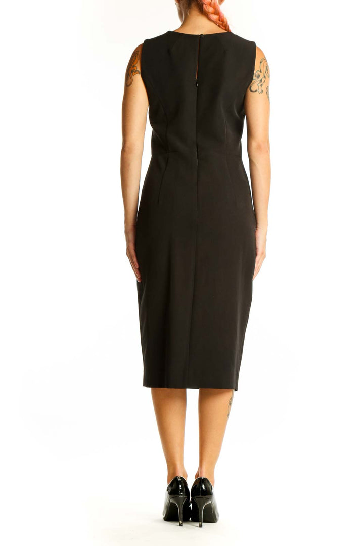 Side view of black Milly midi dress showing ruffle cascade