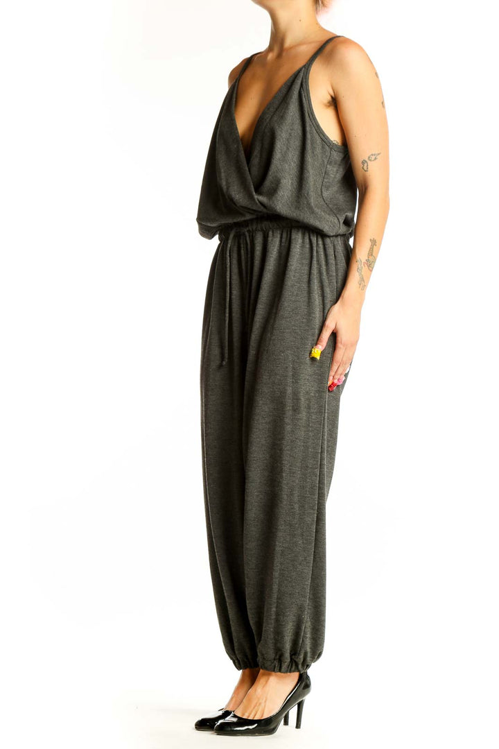 Front view of Nine Britton charcoal gray cotton jumpsuit with wrap bodice