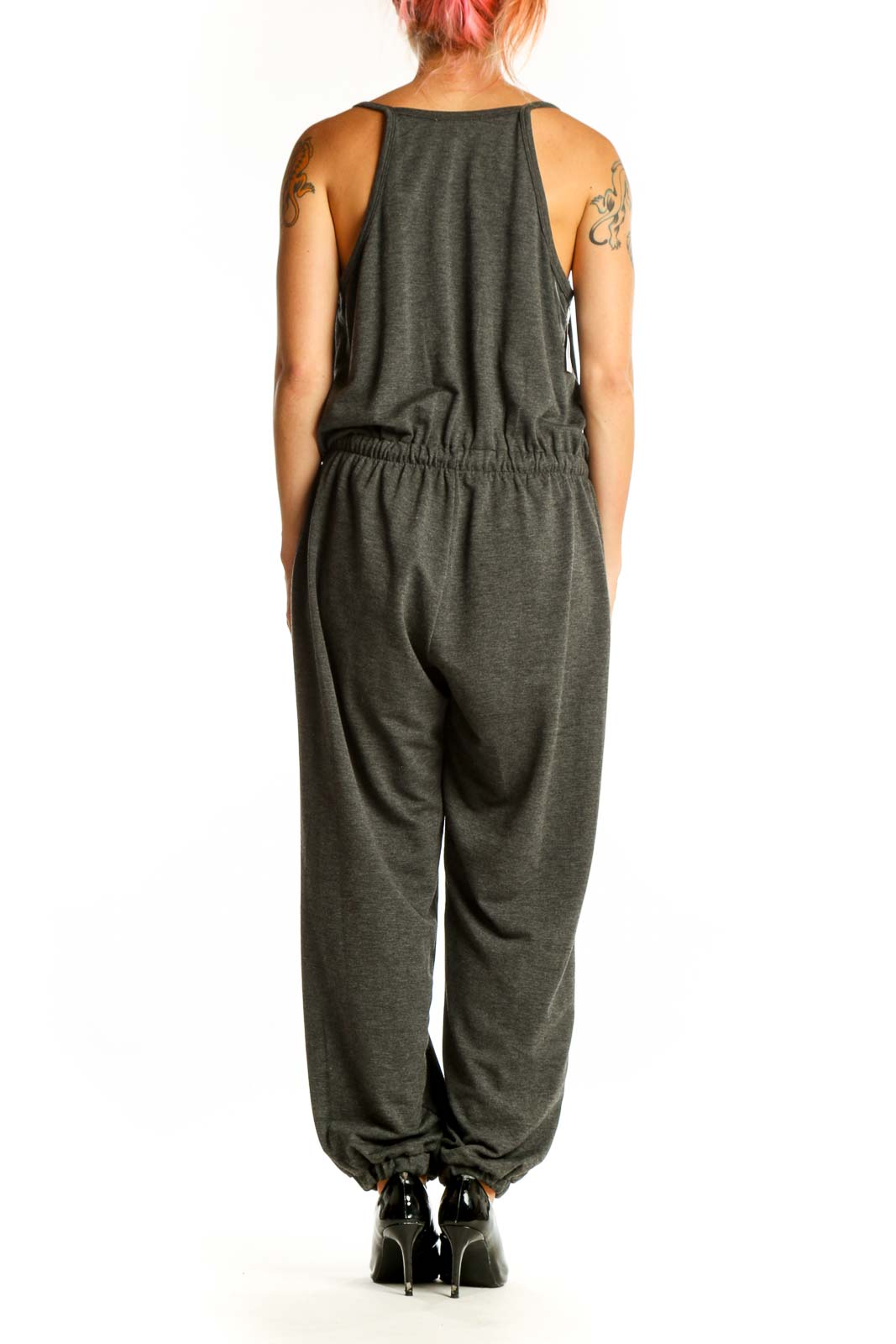 Side view of Nine Britton charcoal gray cotton jumpsuit showing tapered legs