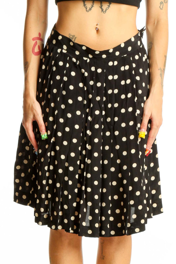 Front view of Laura Ashley black and white polka dot A-line skirt