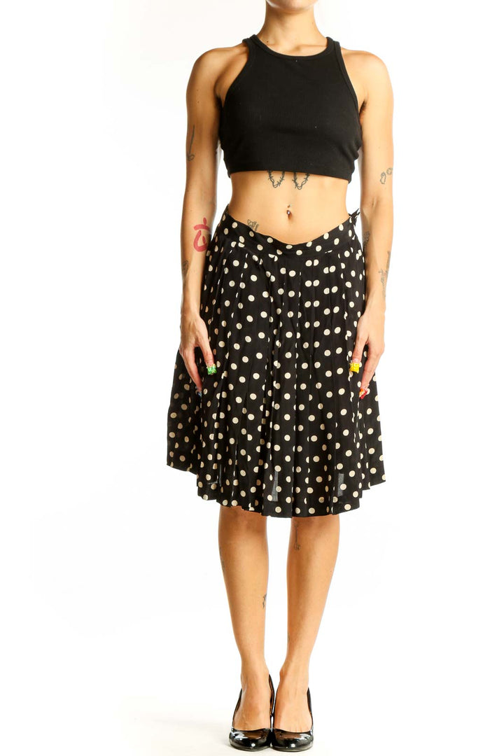 Front view of Laura Ashley black and white polka dot A-line skirt
