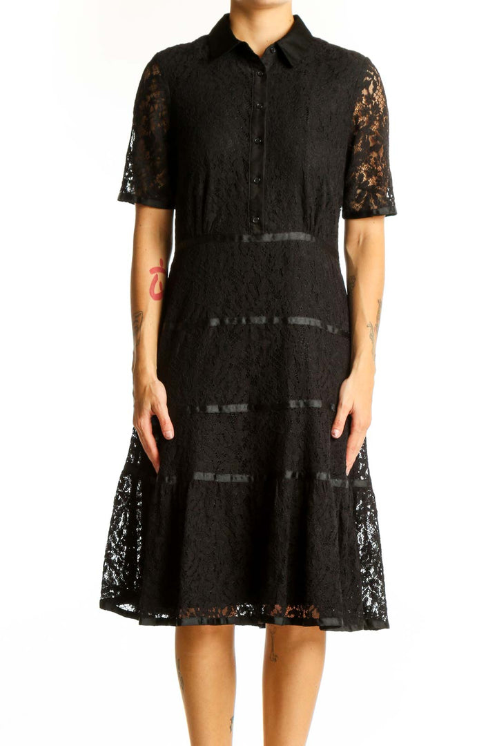 Front view of Nanette Lepore black lace shirt dress with tiered skirt