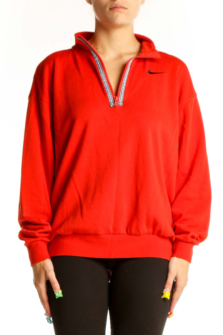 Front view of red Nike half-zip pullover sweatshirt