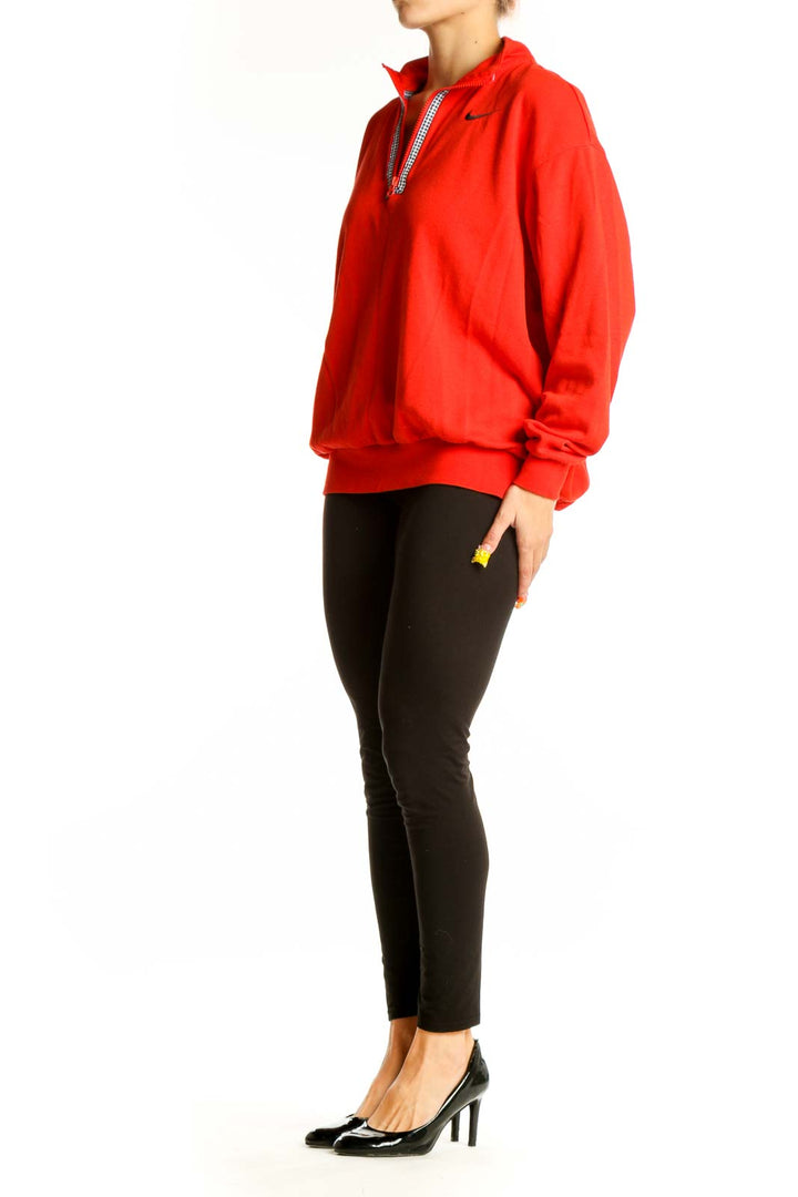 Front view of red Nike half-zip pullover sweatshirt