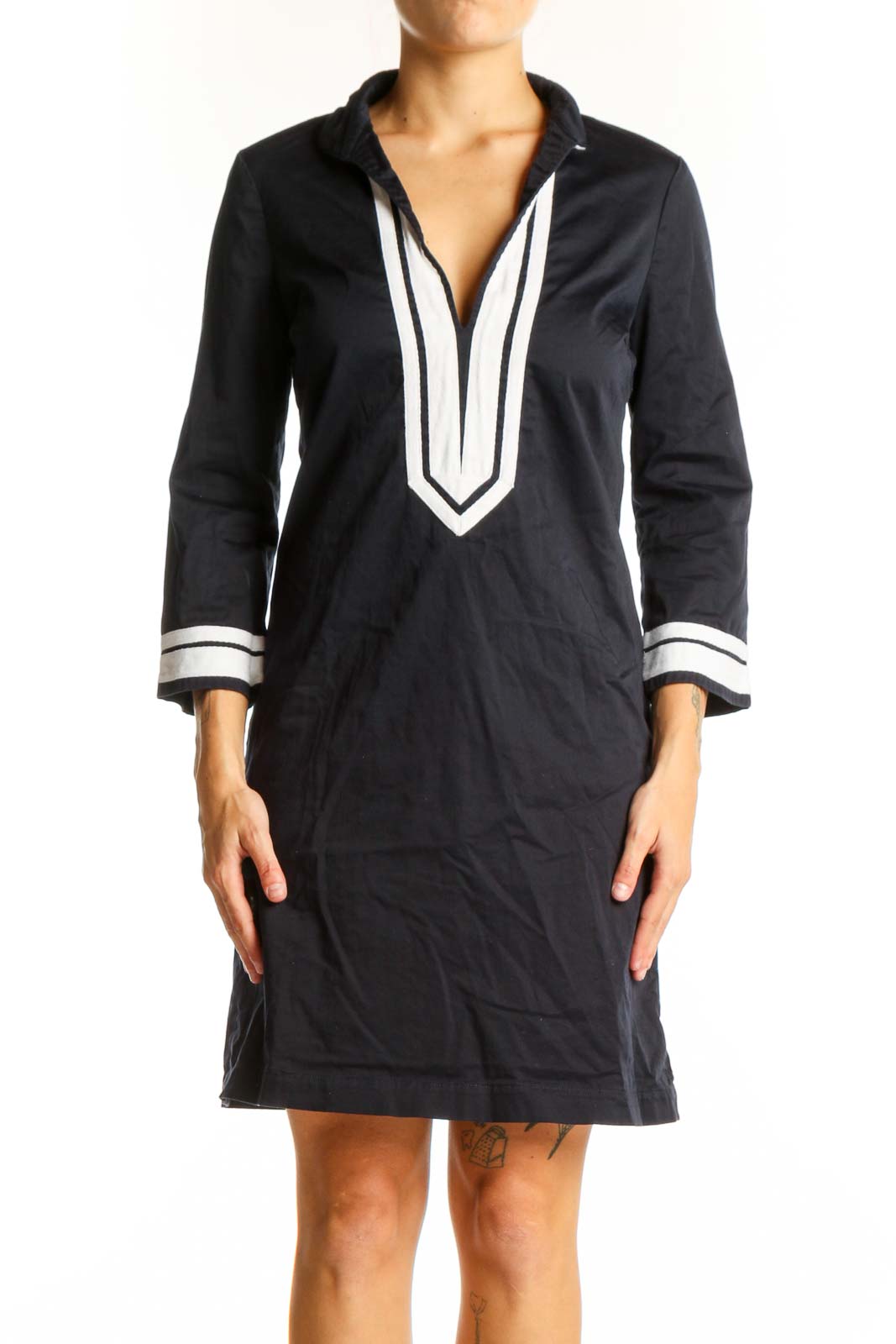 Front view of Tory Burch black tunic dress with white trim and V-neck