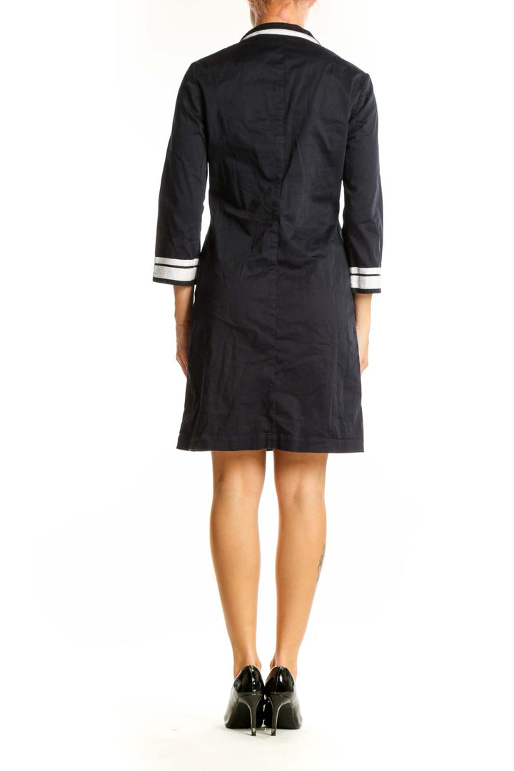 Side view of Tory Burch black tunic dress showing 3/4 sleeves and length